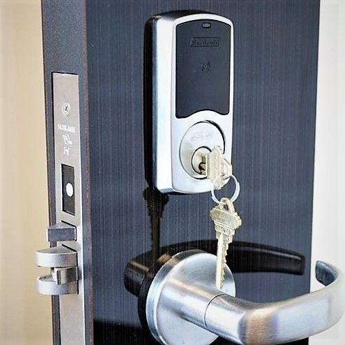 AAA&B Locksmith LLC technician performing commercial lock replacement and installation in Waterbury, CT.